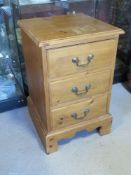 A pine bedside chest of drawers having s