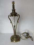 A cut glass and brass table lamp of clas