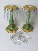 A pair of lustre type ceramic candlesticks having various glass drops (some loose),