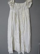 A white cotton and lace Christening robe