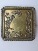 A heavy brass salver having Oriental sty