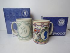 Two large boxed commemorative mugs by We