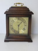 A contemporary Woodford mantle clock hav