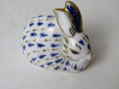 A Royal Crown Derby figurine of a bunny rabbit with gold button. Approx 8cm wide.