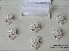 A boxed set of six silver plated frog themed place card holders by Ercuis Paris,