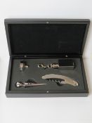 A bar gift set comprising bottle opener, stopper, funnel,