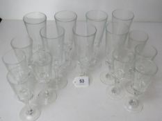 A set of seven champagne flutes together