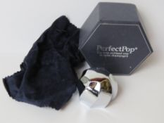 A Perfectpop 'The Only Civilised Way to Open Champagne' in original packaging.