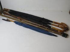 A quantity of vintage umbrellas and walking sticks, inc an umbrella with 9ct rolled gold collar.