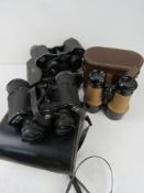 Thre binoculars all in cases, being Weig