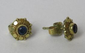 A pair of blue stone stud earrings marked made in Germany to butterfly backs, no apparent hallmarks.