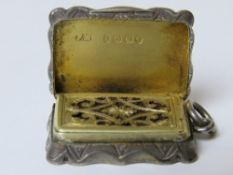 A Victorian silver vinaigrette with sponge, having gilt interior and hinged grill,
