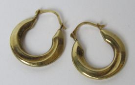 A pair of 9ct gold hoop earrings, stamped 375, 0.7g.