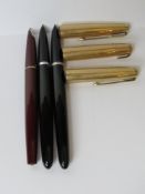 Three Parker fountain pens having concealed nibs.