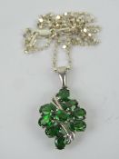 A silver and green gemstone cluster pendant, 3.1cm inc bale, stamped 925, on silver chain.