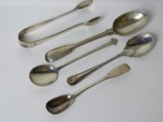 A quantity of HM silver spoons including sugar tongs and preserve spoon.