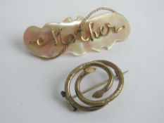 Two vintage brooches 'Mother' on mother of pearl, 5cm wide, and another in pinchbech.