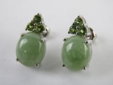 A pair of silver and green stone earrings with butterfly back stamped 925, each measuring 15 x 10mm.