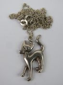 A 925 silver chain having white metal cat pendant upon.