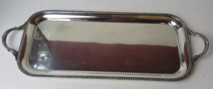 A large and impressive silver plated drinks tray having twin end handles, approx 68cm wide.