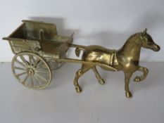 An articulated brass figurine of a horse and cart approx 27cm in length.