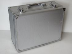 A small flight case 31 x 25 x 14cm.