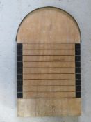 A shove h'apenny board having brass end plate.