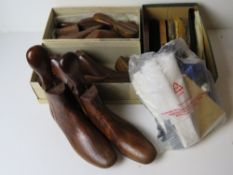 Three pairs of vintage shoe trees together with a quantity of boot brushes, etc.