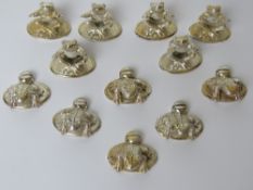 Two sets of silver plated frog themed place card holders.