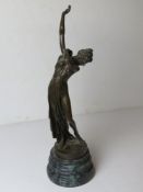 A contemporary bronzed brass figurine of a partially nude female on serpentine base,