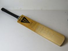 An autograph cricket bat having signatures for Yorkshire,
