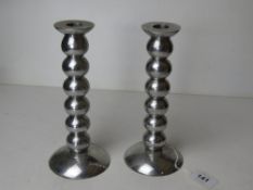 A pair of chrome bobbin turned style candlesticks.