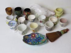 A quantity of assorted egg cups inc a Royal Worcester Reg No 546206 and other ceramic items.