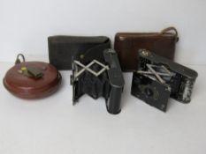 Two vintage Eastman Kodak Company Vest Pocket Autographic Kodak Cameras together with a vintage