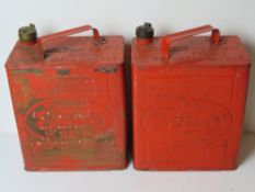 Of automotive interest; two red painted vintage Esso cans, one with brass cap,