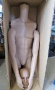 A male mannequin being torso, head and arms.