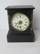 A Victorian black slate and marble architectural mantle clock manufactured by the Ansonia Clock