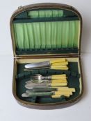A wooden canteen of assorted stainless steel ivorex handled cutlery inc four fish knives and forks