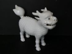 A late 19th / early 20thC Japanese Hirado porcelain figure of a Kirin - mythical creature having