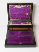 An unusual purple silk lined writing slope having fold over velvet slope inlaid verso with mother