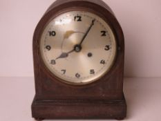 A vintage mantle clock having silvered d