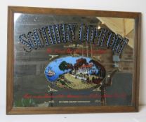 A Southern Comfort themed wall mirror in frame.