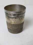 A silver plated 'Just A Thimble' tot cup.