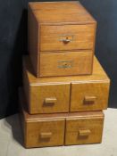 A pair of filing drawer units each having two slim drawers. Together with another similar.