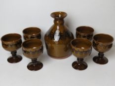 A glazed mid century pottery carafe with