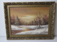 A contemporary oil on canvas of a snowy scene in gold painted frame.