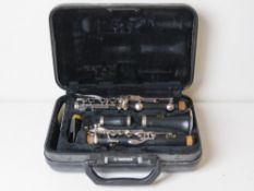 A Yamaha clarinet in case.