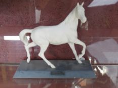 A Beswick horse in matt white on black b
