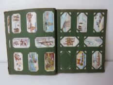 A Cigarette card album having assorted sets and part sets within.