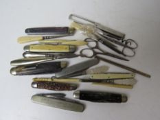 A quantity of assorted pocket knives and sewing ephemera.